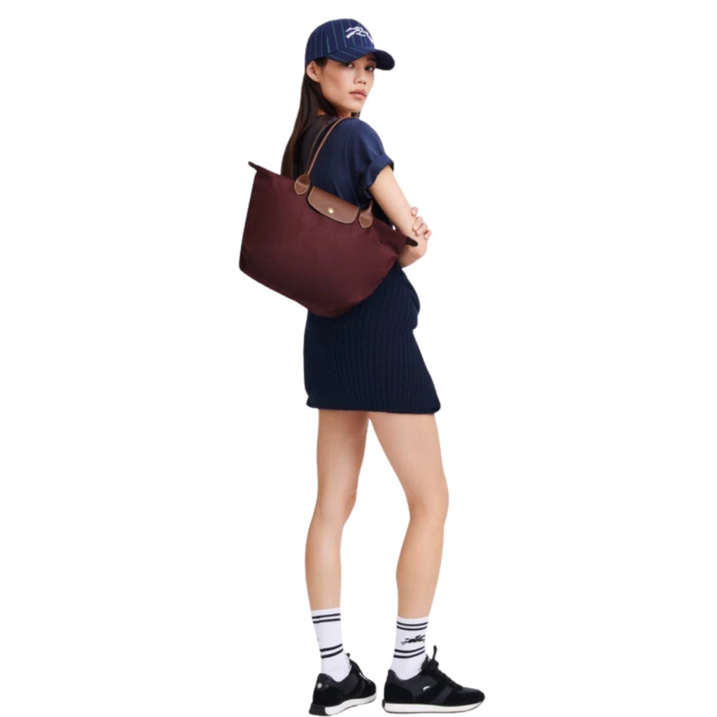 Longchamp Le Pliage Medium in burgundy – styled view